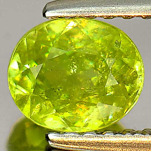 0.90 Ct. Oval Natural Yellowish Green Titanium Sphene With Rainbow Spark