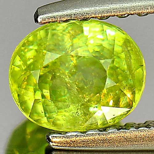 0.89 Ct. Nice Oval Natural Yellowish Green Titanium Sphene With Rainbow Spark
