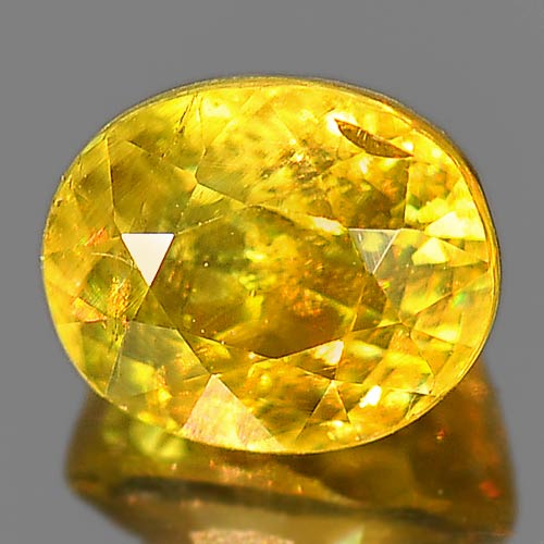 0.97 Ct. Oval Natural Greenish Yellow Titanium Sphene Rainbow Spark Sz 6 x 5 Mm.