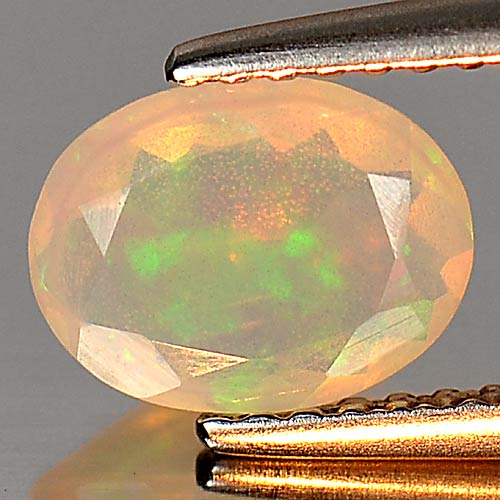 0.58 Ct. Attractive Natural Gem Multi Color Play Of Colour Opal Oval Shape